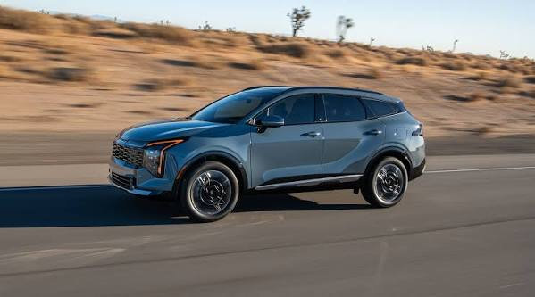 2026 Kia Sportage light blue side view in motion — sleek aerodynamic profile, roof rails, panoramic roof, compact SUV export from China FOB Nansha Globalucar