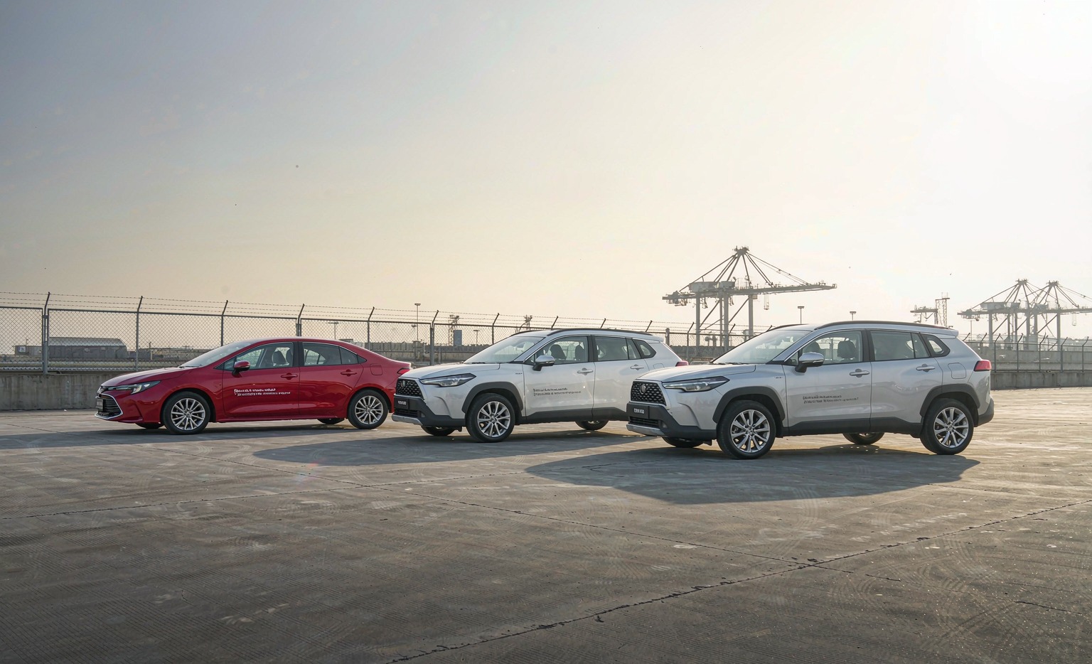 Toyota Corolla Family 2026 wholesale comparison — Sedan 1.8L Hybrid, Corolla Cross 2.0L Intelligent Hybrid and Frontlander 2.0L Intelligent Hybrid lineup at Chinese export yard