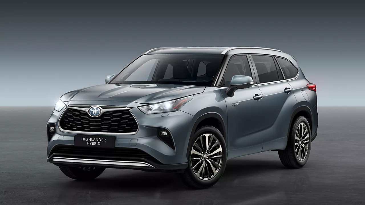 Toyota Highlander Ultimate Edition interior — 12.3-inch touchscreen, digital instrument cluster, leather seats, wood trim, JBL audio, dual motor hybrid