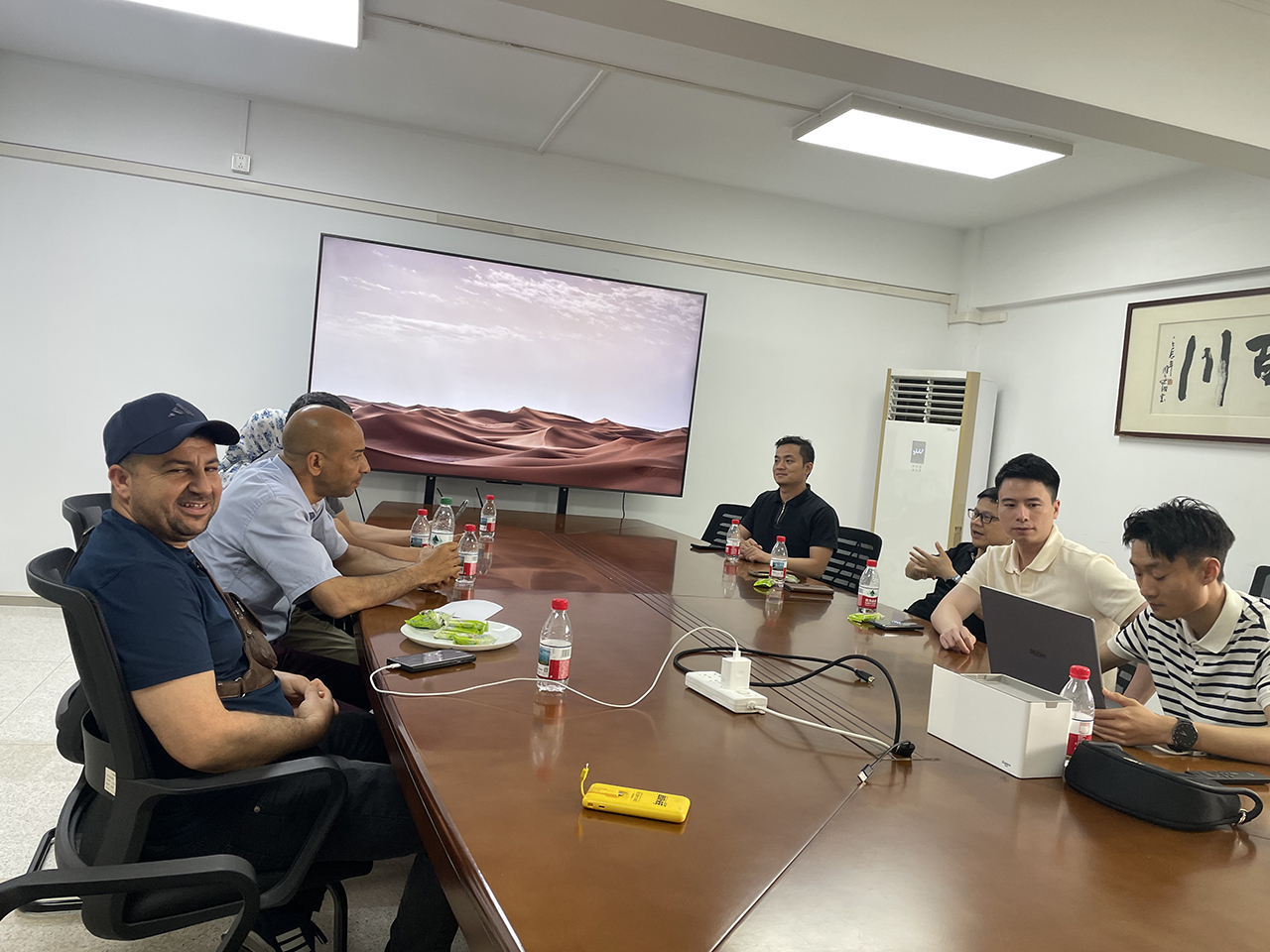 Factory reception welcoming international car buyers at Guangzhou facility